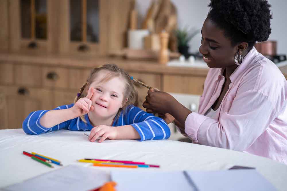 doing-hair-smiling-with-down-syndrome